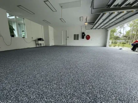 Gray flake garage floor by Ironclad Floors